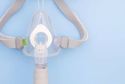 cpap mask on blue background